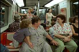 Laura Cadieux (Ginette Reno) and Mme Therrien (Pierrette Robitaille) run into each other on a train in C't'à ton tour, Laura Cadieux