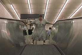 Laura Cadieux (Ginette Reno) confronts the moving sidewalk at Beaudry in C't'à ton tour, Laura Cadieux