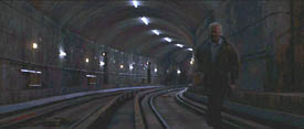 The Jackal (Bruce Willis) flees through a metro tunnel in The Jackal