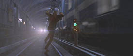 Declan Mulqueen (Richard Gere) leaps out of the way of an oncoming train in The Jackal