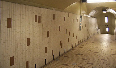 Original tiles, wall at the end of the bridge