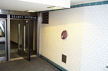 Paris metro style white bevelled tiles below the Guimard entrance