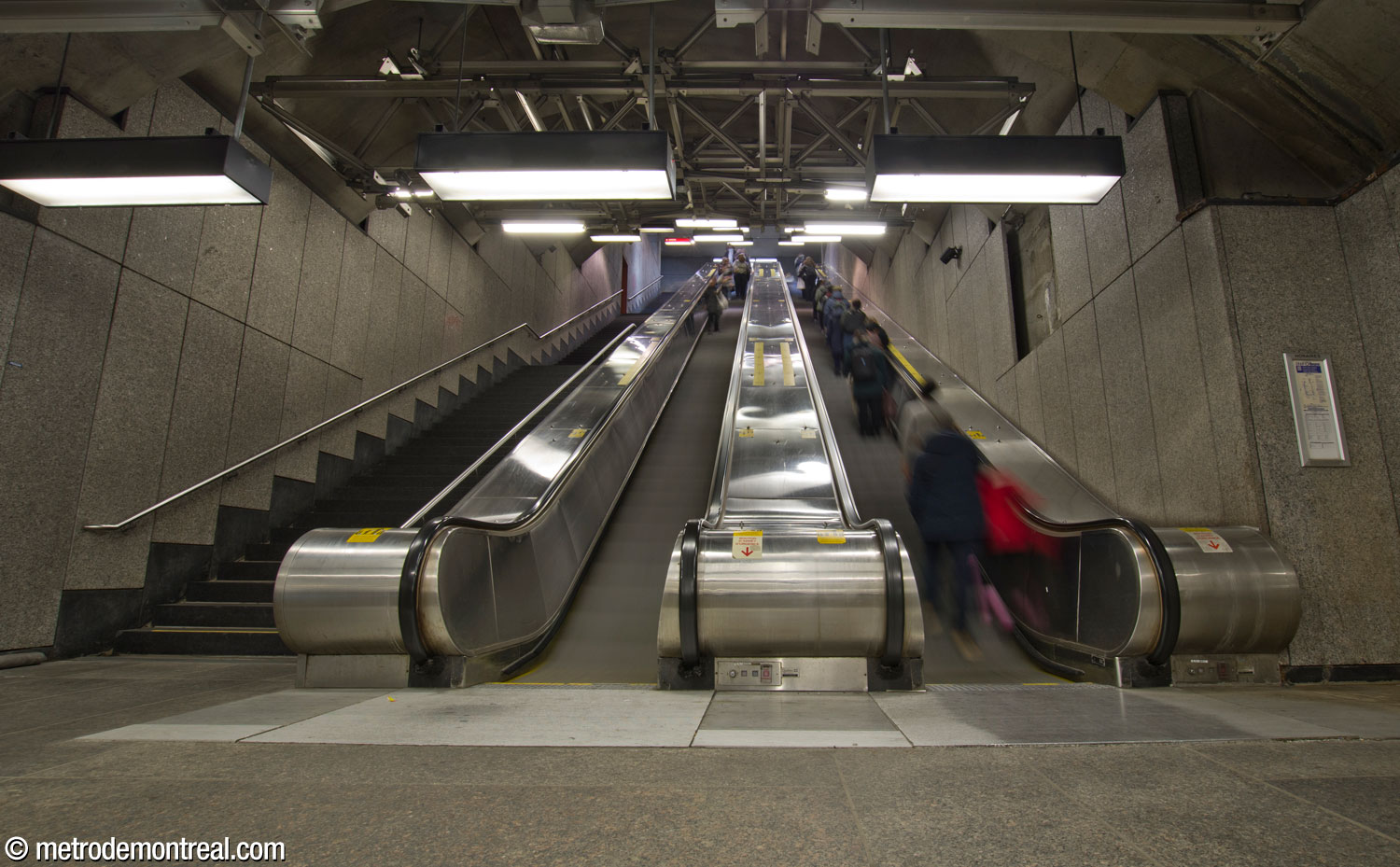 The tall but low-ceilinged stairwell from the ticket hall tunnel up to the Côte-des-Neiges Ouest headhouse.
