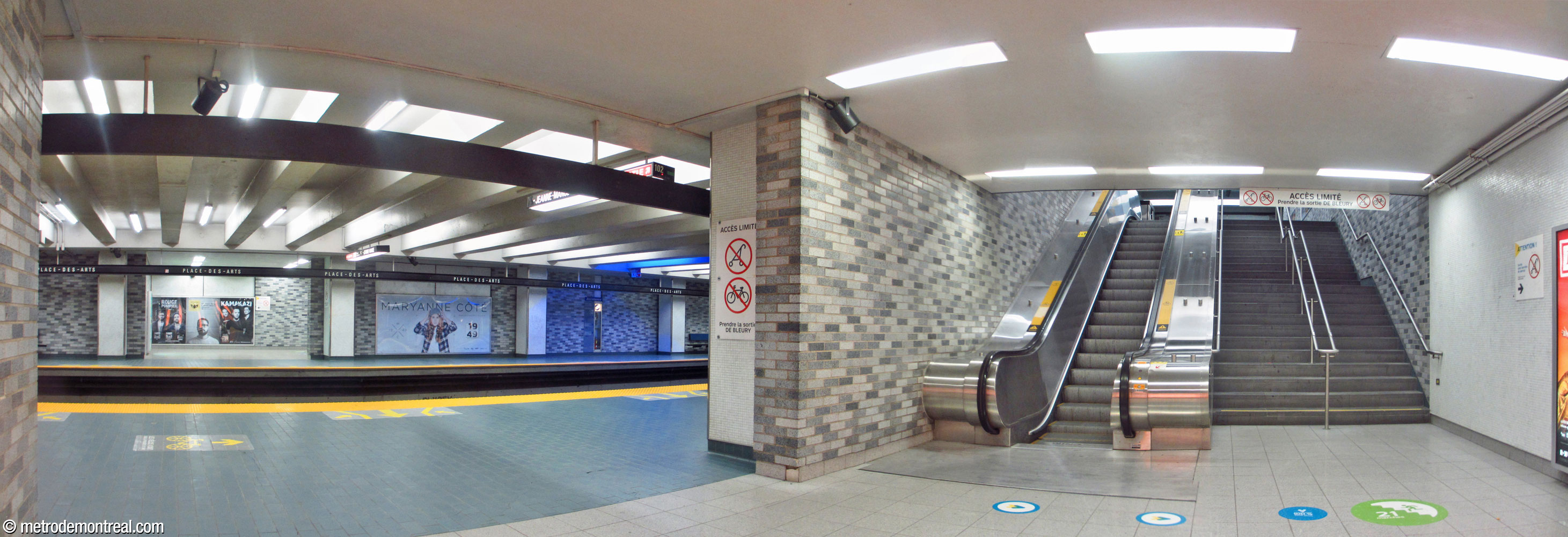 The bottom of the staircase leading to the exit-only turnstile doors, in the eastern part of the Honoré-Beaugrand platform. The corresponding access from the other platform is seen across the tracks.