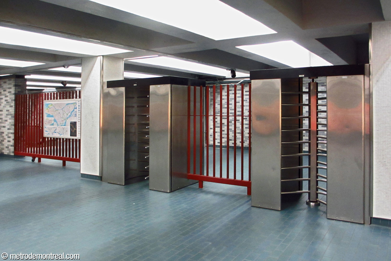 The exit-only turnstile doors leading to the station concourse.